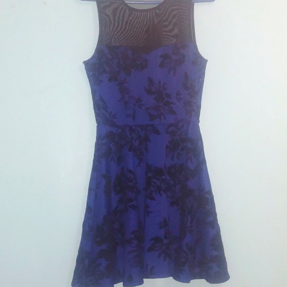 This is a medium blue and black dress with black flowers on it from Trixxi
